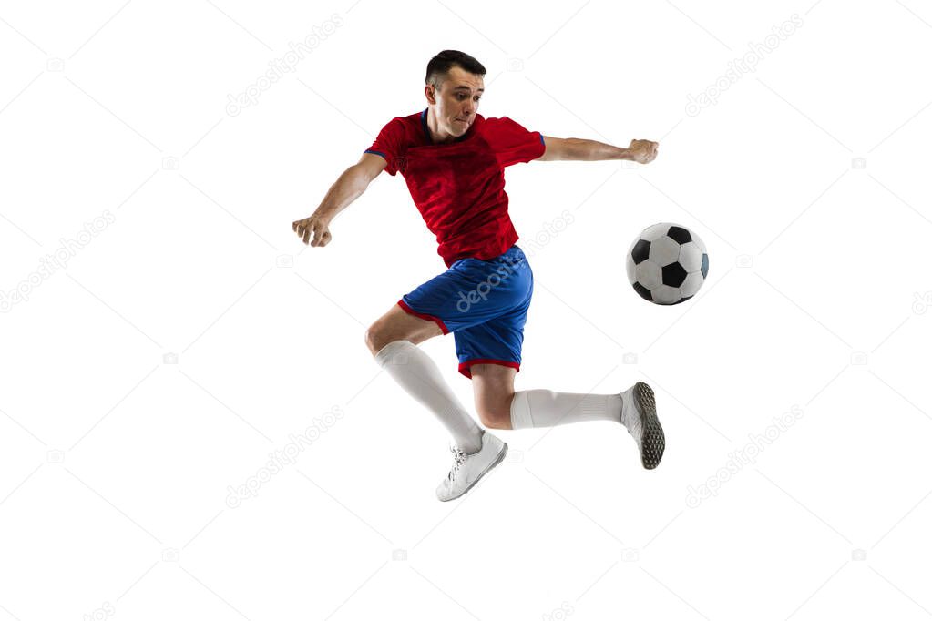 Young Caucasian soccer football player training isolated on white background.