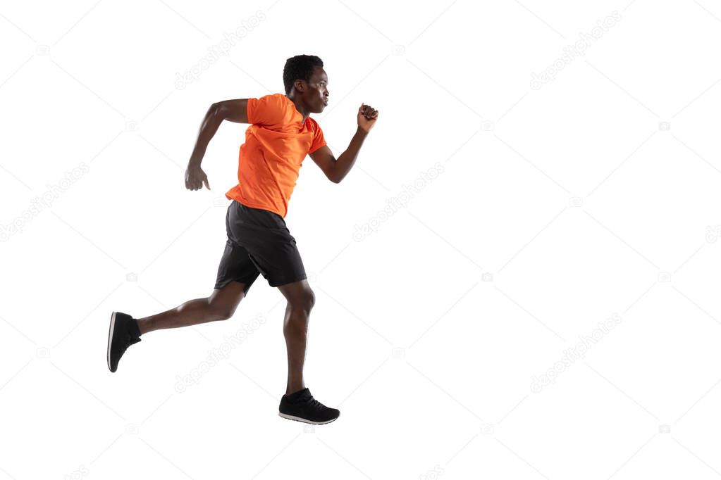 One young African-American man, athlete isolated over white background.