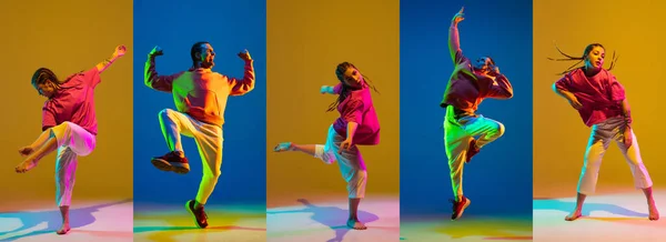 Jong meisje en man dansen hip-hop in heldere kleding op kleurrijke achtergrond in neon licht — Stockfoto