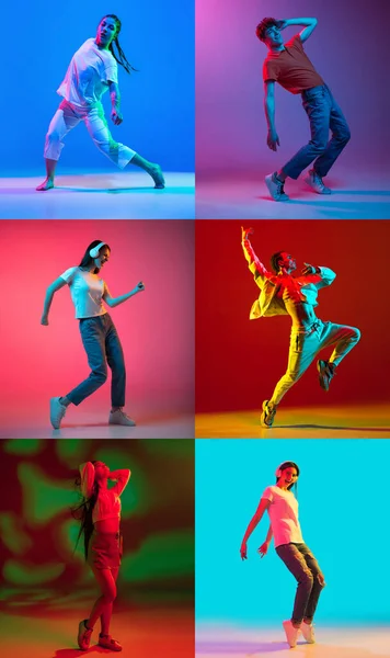 Young girls and men dancing hip-hop in bright attire on colorful background in neon light — Stockfoto