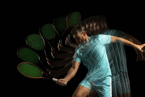 Bir adam, profesyonel tenisçi, karışık neon ışıkta siyah arka planda izole edilmiş. Stroboskop