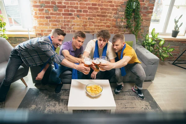 High angle view of young people watching TV, sport match together. Concept of friendship, leisure activity, emotions — Stock Photo, Image