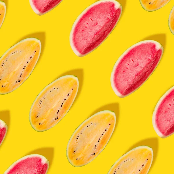 Creative image. Red and yellow watermelon slices on bright yellow background. — Stock Photo, Image