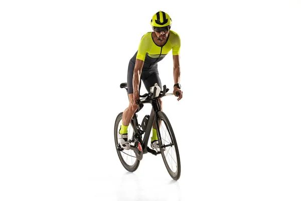 Fast and active. One young professional bicyclist, man on road bike isolated over white background. — Foto de Stock