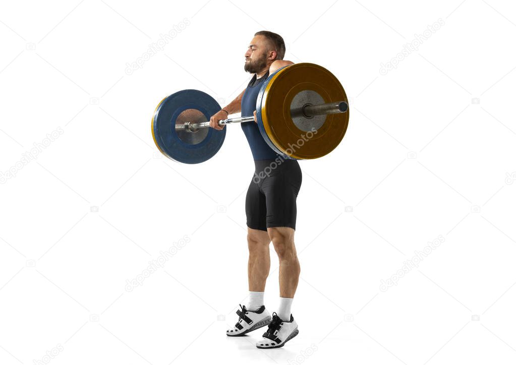 Full length portrait of a man in sportswear exercising with a weight isolated on white background