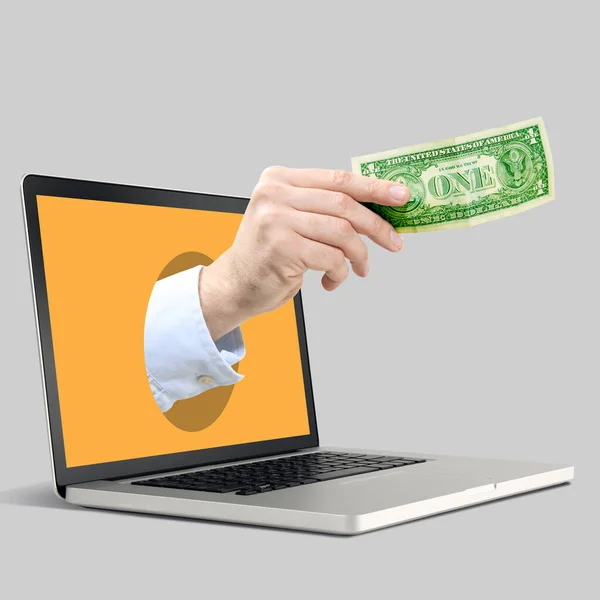 Współczesny kolaż sztuki. mężczyzna ręka gospodarstwa pieniądze wystające z pomarańczowy laptop ekran nad szary tło. — Zdjęcie stockowe