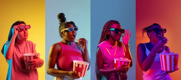 Quatre jeunes femmes avec du pop-corn isolé sur des fonds colorés dans des néons. Dépliant — Photo