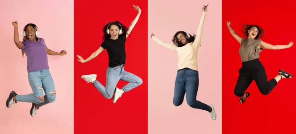 Quatro jovens mulheres alegres em movimento isoladas sobre fundos coloridos. Folheto — Fotografia de Stock