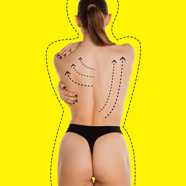Gyönyörű női test fekete alsóneműben sárga háttér felett. Szépségápolási koncepció — Stock Fotó