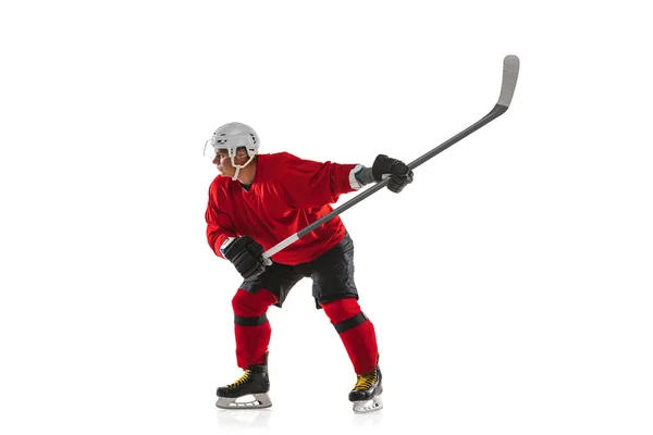 Full-length image of professional male hockey player training isolated over white background — Stock Photo, Image