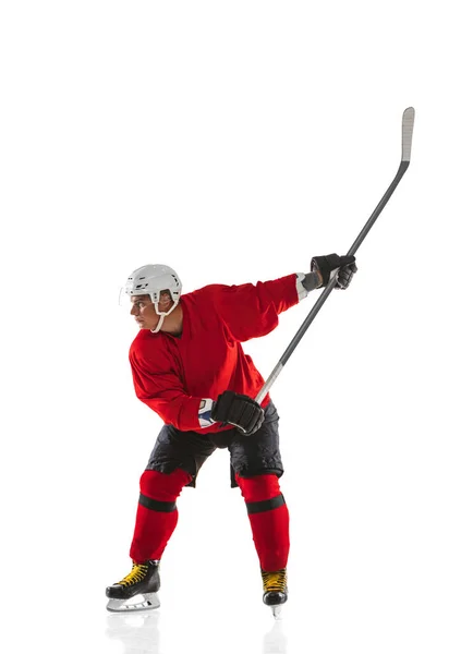 Portrait of professional male hockey player training isolated over white background — Stock Photo, Image