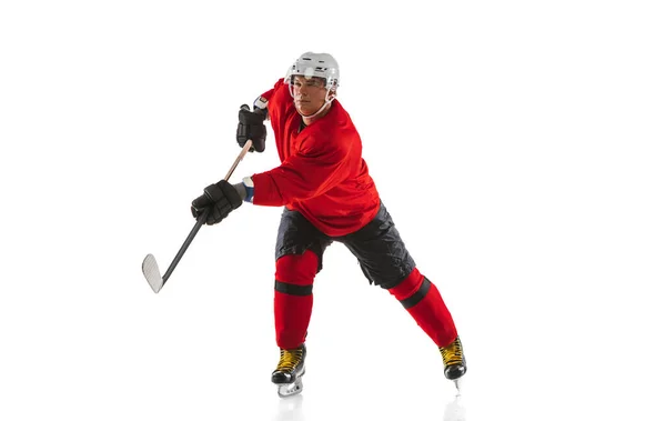 Full-length image of professional male hockey player training isolated over white background — Stock Photo, Image