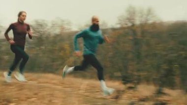 Dynamic trail run through autumn landscape. Concept of speed training, athletic energy, and motion-driven visuals for sportswear advertising, digital fitness storytelling, and performance marketing.