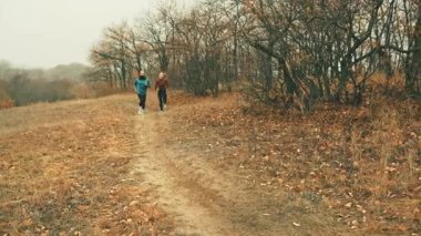 Healthy lifestyle jogging in autumn park. Concept of everyday fitness habits, balanced wellness routines, and accessible outdoor exercise visuals for lifestyle brands and health-related communication.