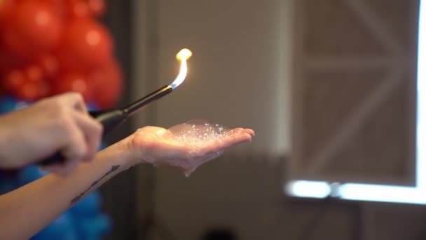 Soap bubble show. solution is set on fire on the animators hand. — Stock Video