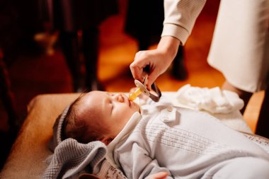 a baby fell asleep on a dressing table in a Church. the ordinance of baptism.