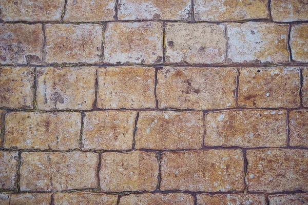 Фон кам'яна тротуарна плитка. дорога, вимощена камінцями. текстура цегли . — стокове фото