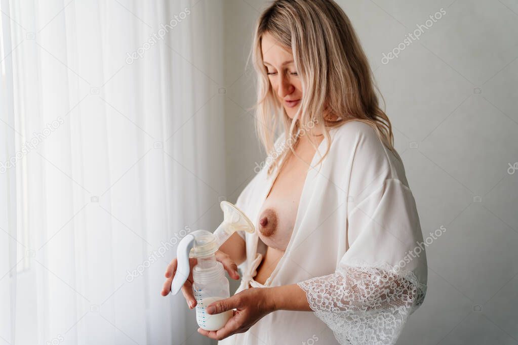 a woman uses a breast pump. improved lactation, breast milk supply, feeding. 