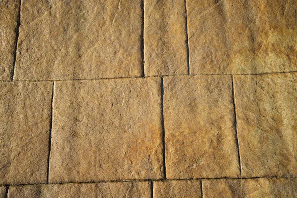 Pared de ladrillos de piedra rectangulares. fondo y textura de adoquines. — Foto de Stock