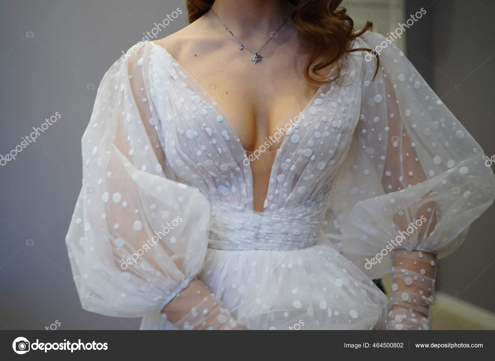 A Beautiful Young Woman in a Lace Robe at the Bathroom Door Stock