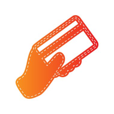 Bir kredi kartı tutan el. Turuncu aplike izole.