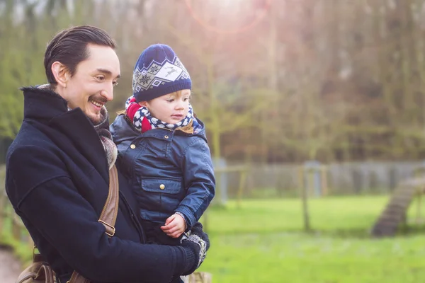 father and son walking in the park