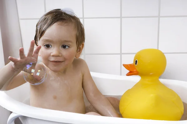 Happy toddler taking a bath — Stock Photo, Image