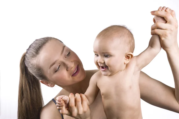 Happy mother and baby practicing standing up. — Stock Photo, Image