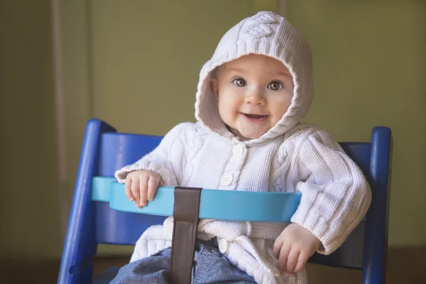 Beautiful baby girl in a chair — Stock Photo, Image