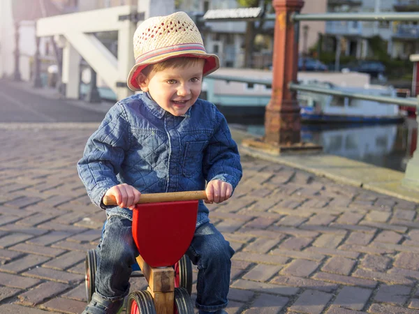 Adorable toddler on a tricycle — Stock Photo, Image