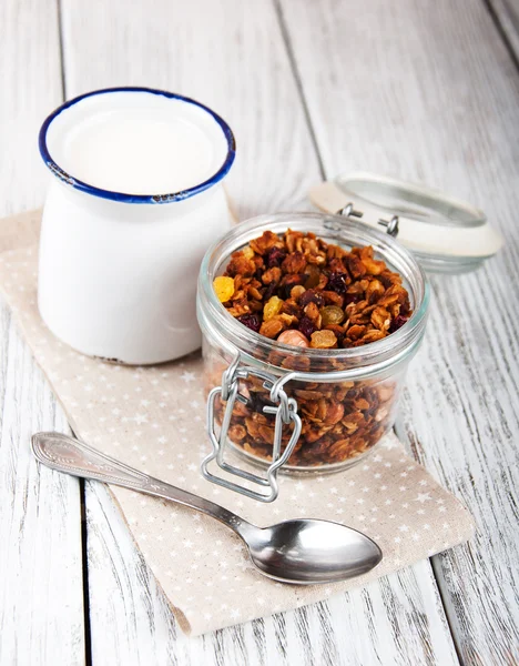 Homemade granola in open glass jar — Stock Photo, Image