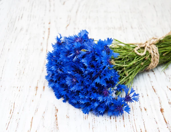 Blue cornflowers on the table — Stock Photo, Image