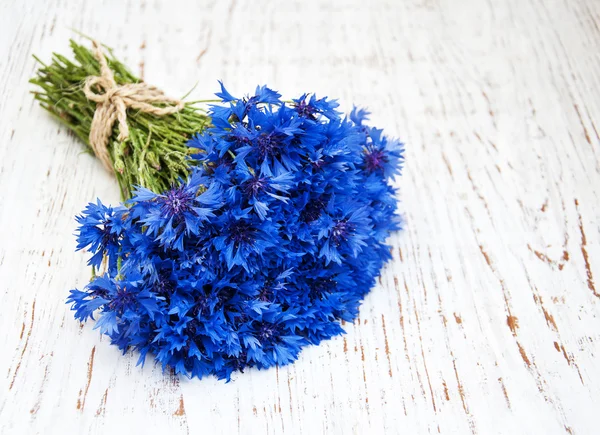 Blue cornflowers on the table — Stock Photo, Image