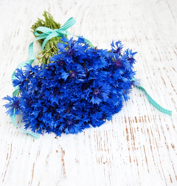 Blue cornflowers on the table — Stock Photo, Image