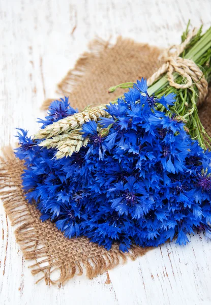 Blue cornflowers on the table — Stock Photo, Image