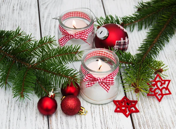 christmas decorations candles in glass jars with fir