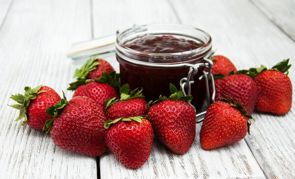 Strawberry jam and fresh strawberries