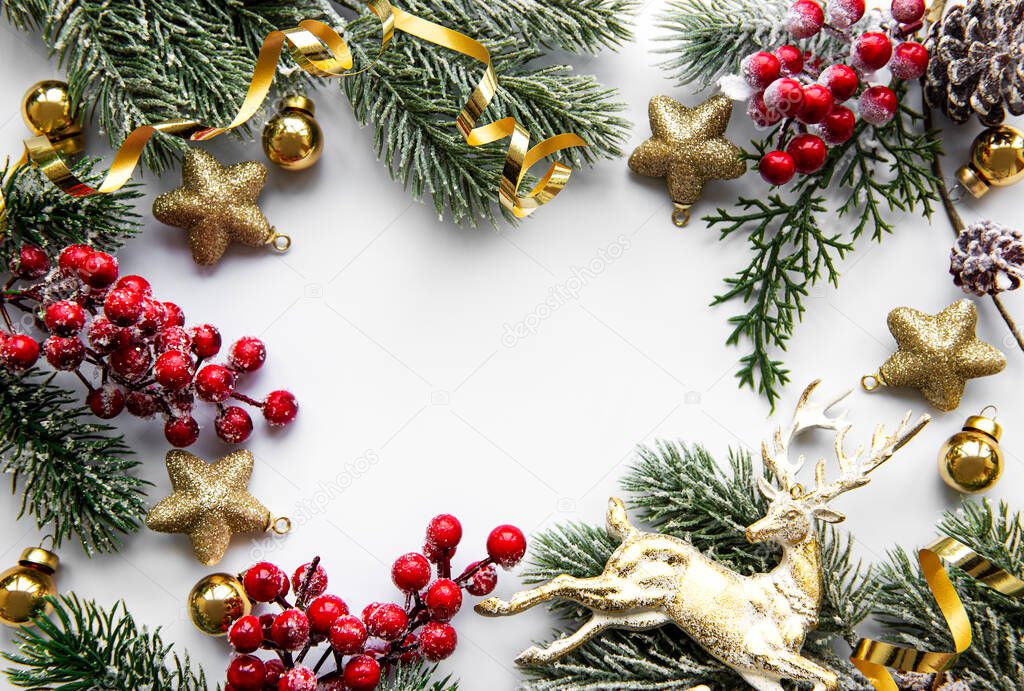 Christmas composition. Fir tree branches, red decorations on white background. Christmas, winter, new year concept. Flat lay, top view, copy space