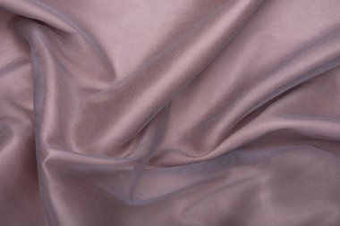 Güzel, pürüzsüz, zarif, açık kahverengi, saten, lüks kumaş kumaş, soyut arka plan tasarımı. Boşluğu kopyala.