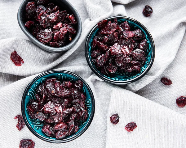 Bowls Full Sweet Dried Cherries Grey Textile Background — Stock Photo, Image