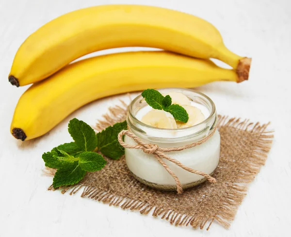 Banana with natural yoghurt — Stock Photo, Image