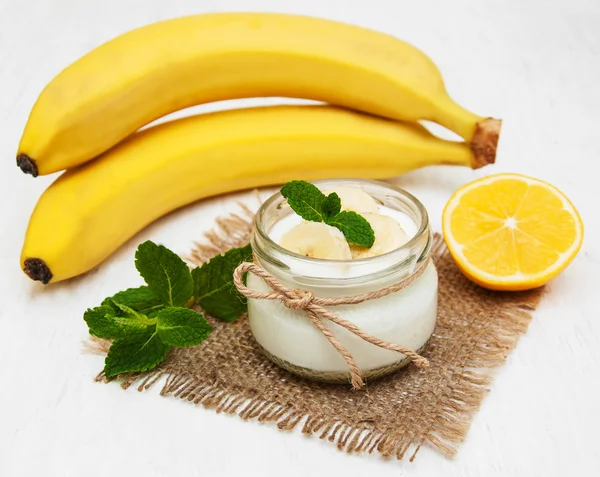 Banana with natural yoghurt — Stock Photo, Image