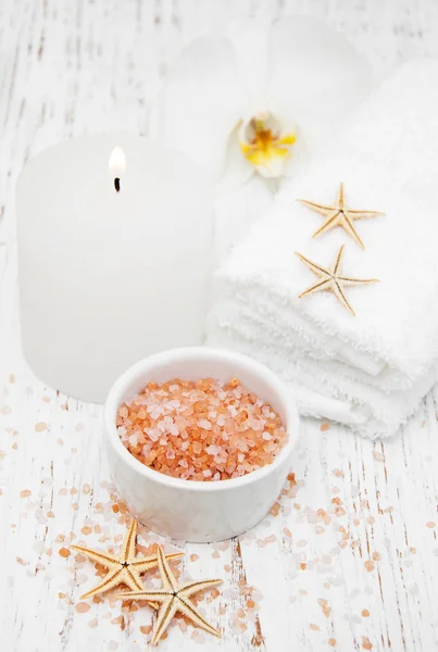 Spa setting with orchid, towels, candle and salt — Stock Photo, Image
