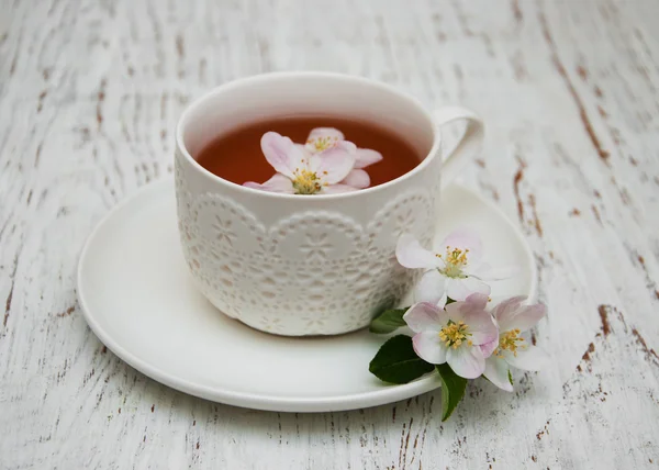 Cup of tea and spring blossom — Stock Photo, Image