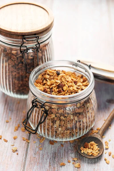 Glass jar filled with healthy granola, ready for a wholesome breakfast