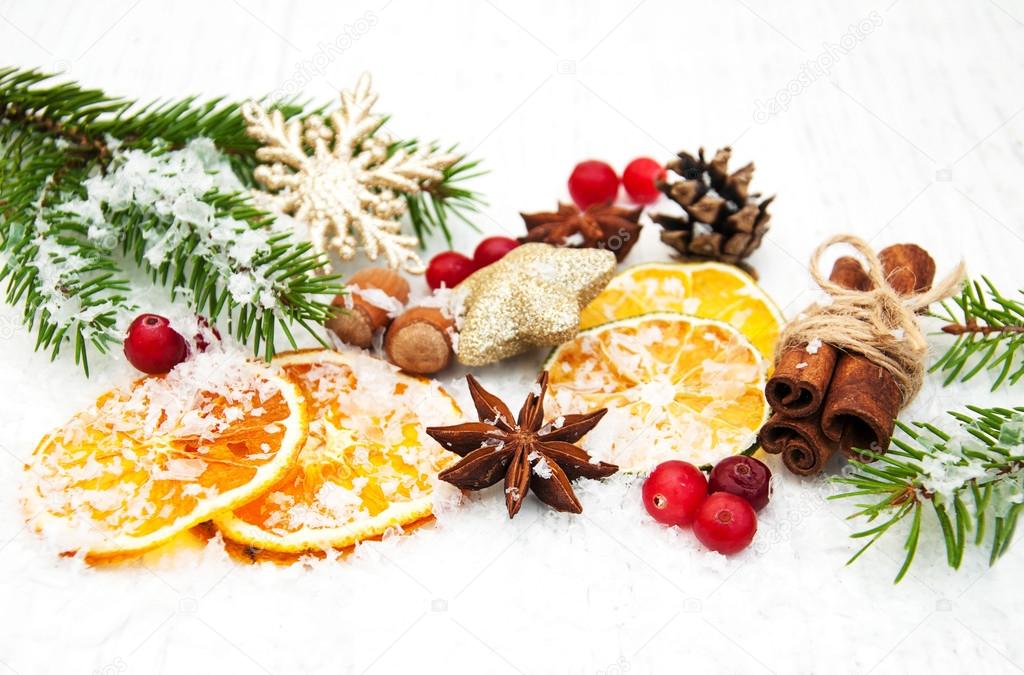 different kinds of spices,  nuts and dried oranges
