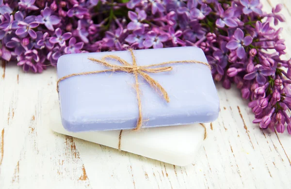 Natural soap and lilac flowers — Stock Photo, Image