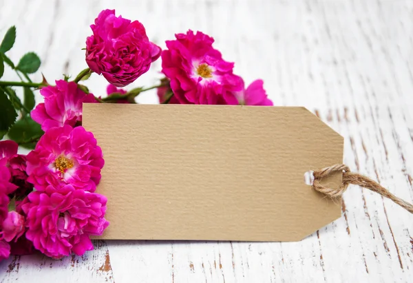 Rosas con una tarjeta —  Fotos de Stock
