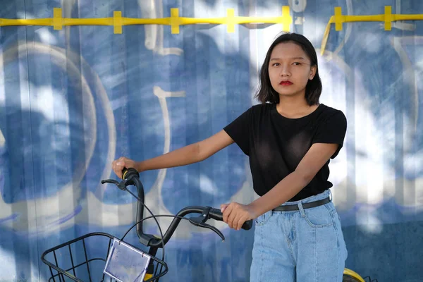 Portrait Asian Young Girl Wear Jean Black Shirt Yellow Bicycle — Stock Photo, Image