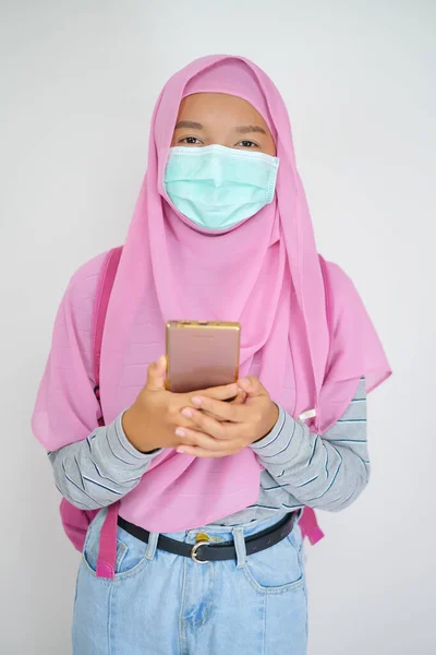 Student Young Girl Uses Mobile Phone Wear Mask White Background — Stock Photo, Image